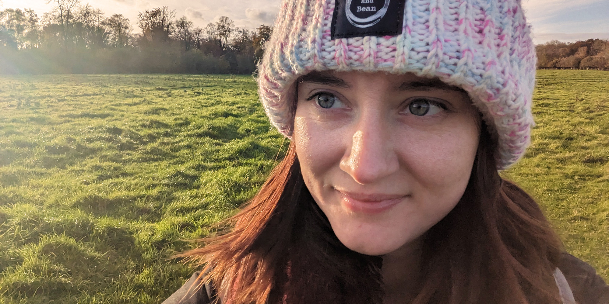 Apprentice Jackie Ann Judge wears winter clothing in a field at dawn