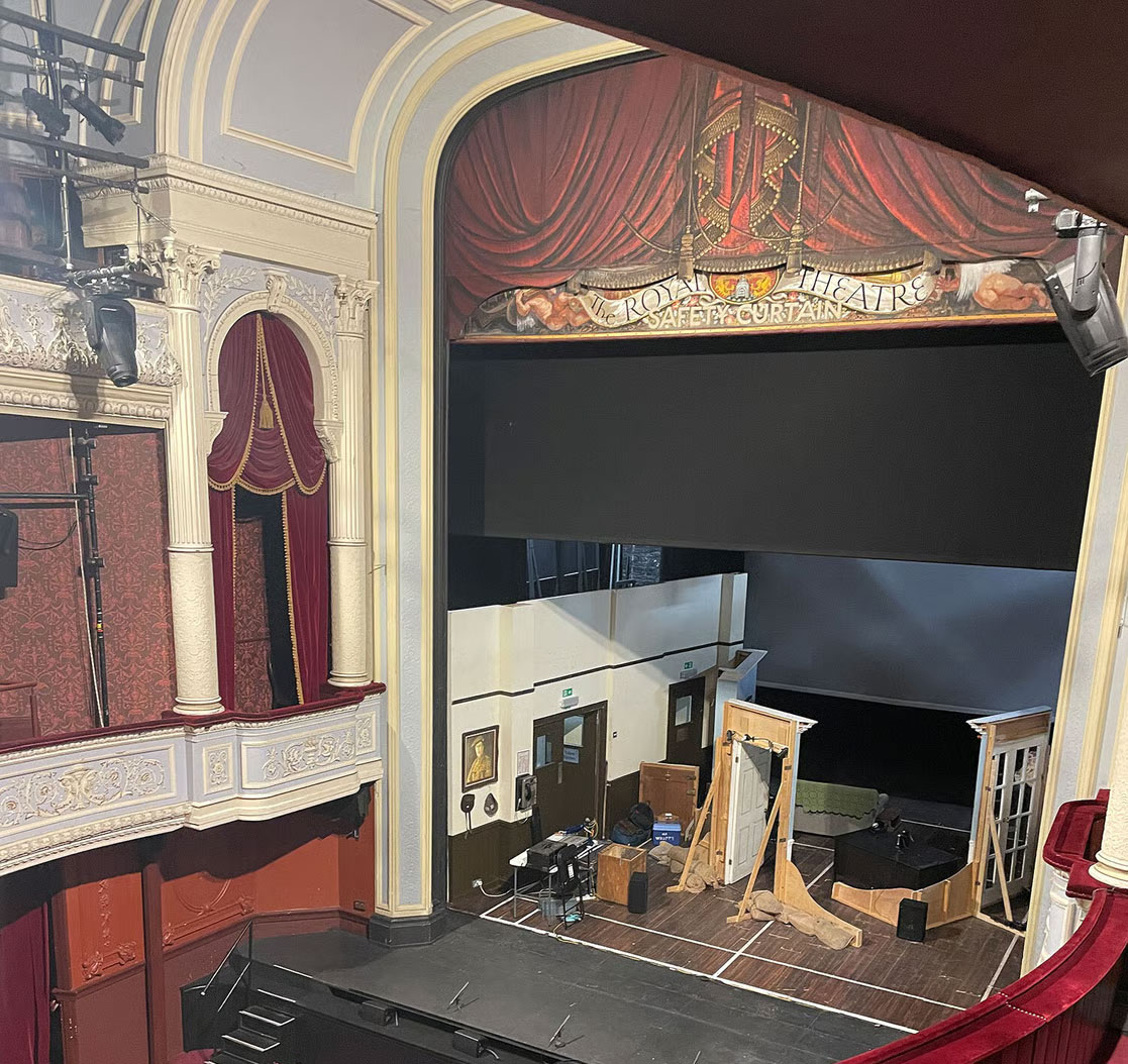 Interior view looking towards the stage of a theatre.