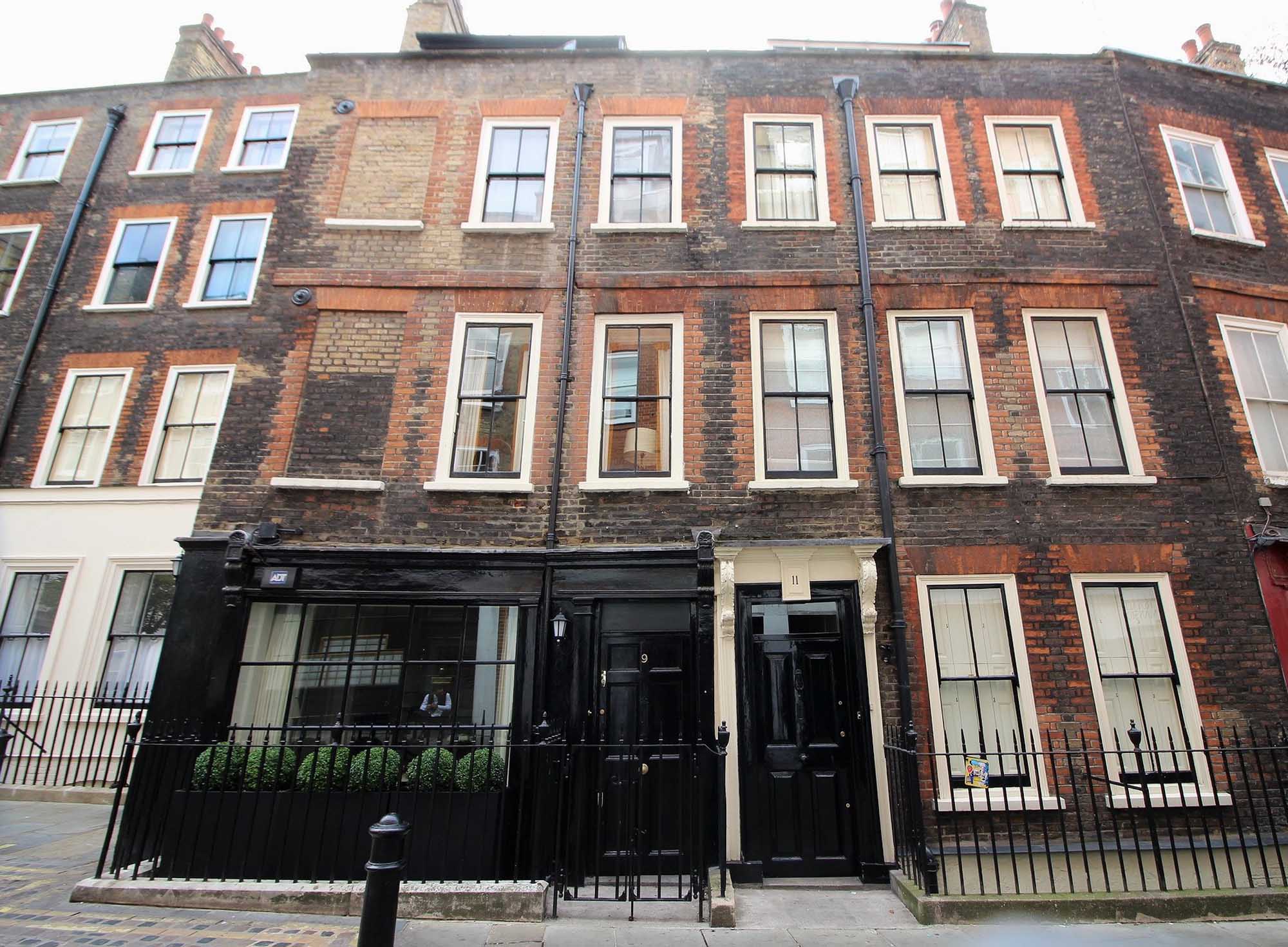 View of Georgian building with railings in front of it.