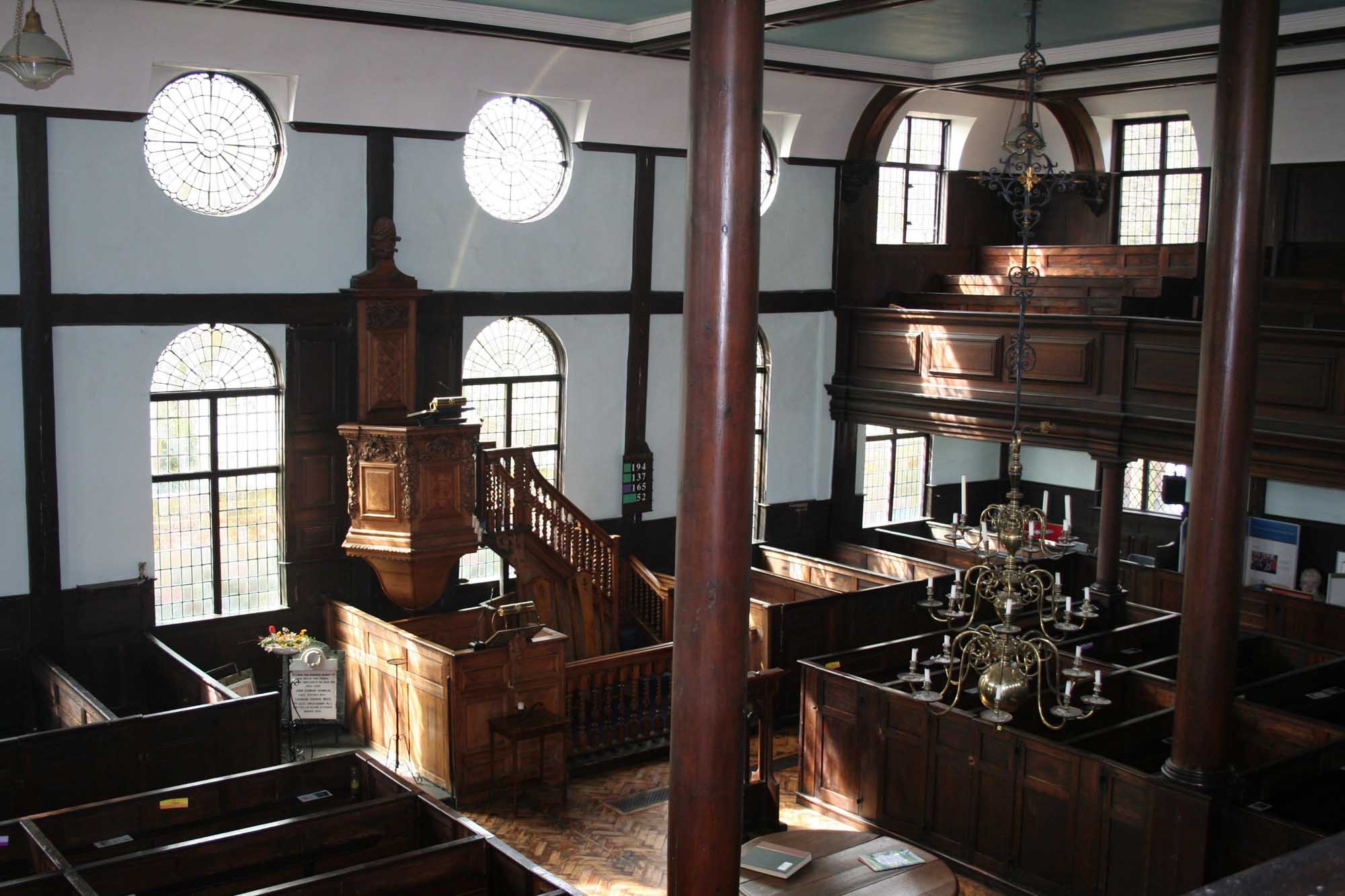 The interior of the Unitarian Meeting House in Ipswich is classically grand with wooden box pews and a beautifully carved pulpit.