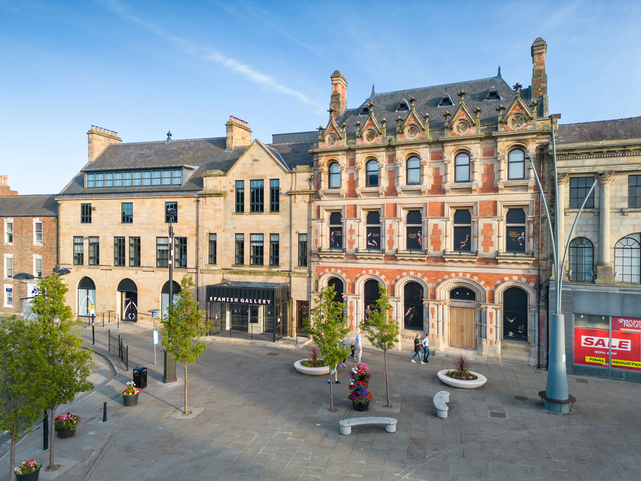 Detail of a market town square including historic buildings repurposed as a gallery.
