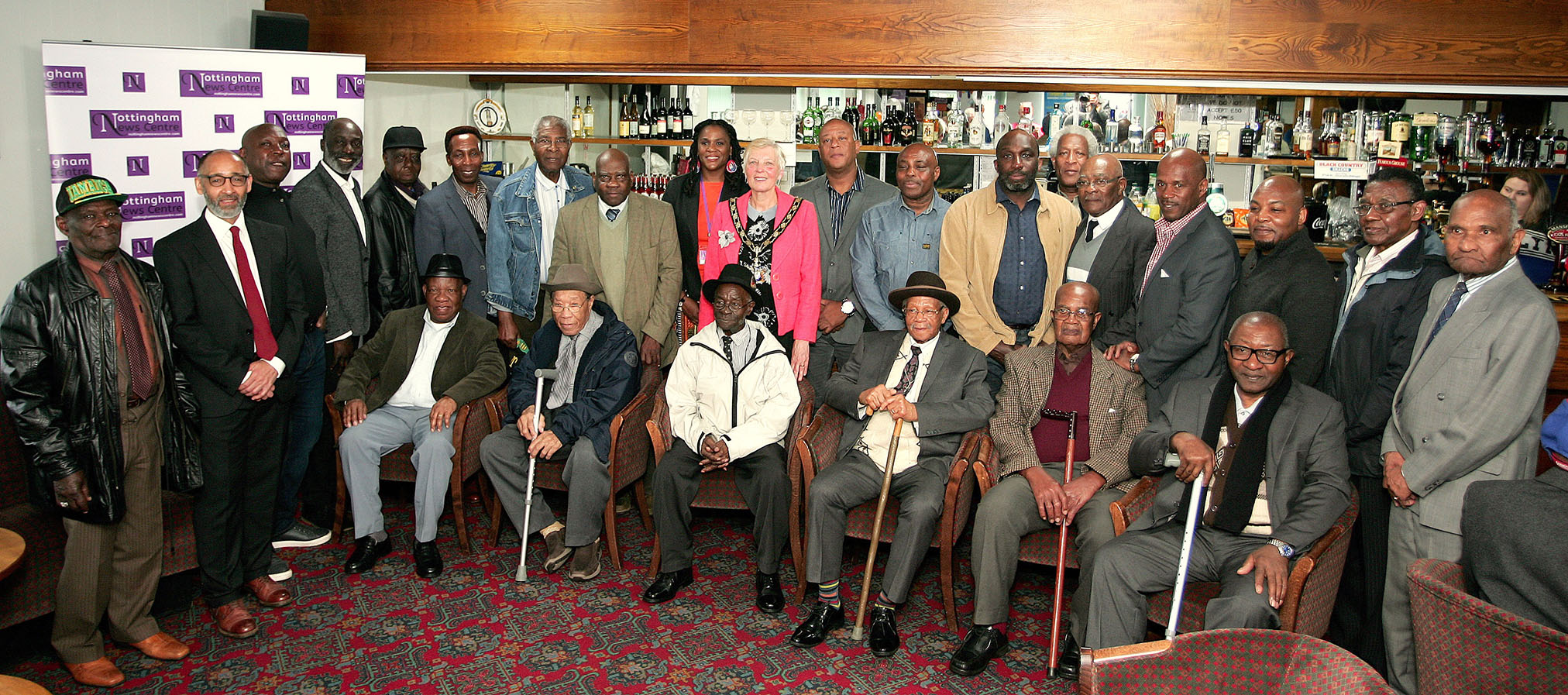 Former miners pose for a group photo at a reunion organised by the Black Miners Museum.