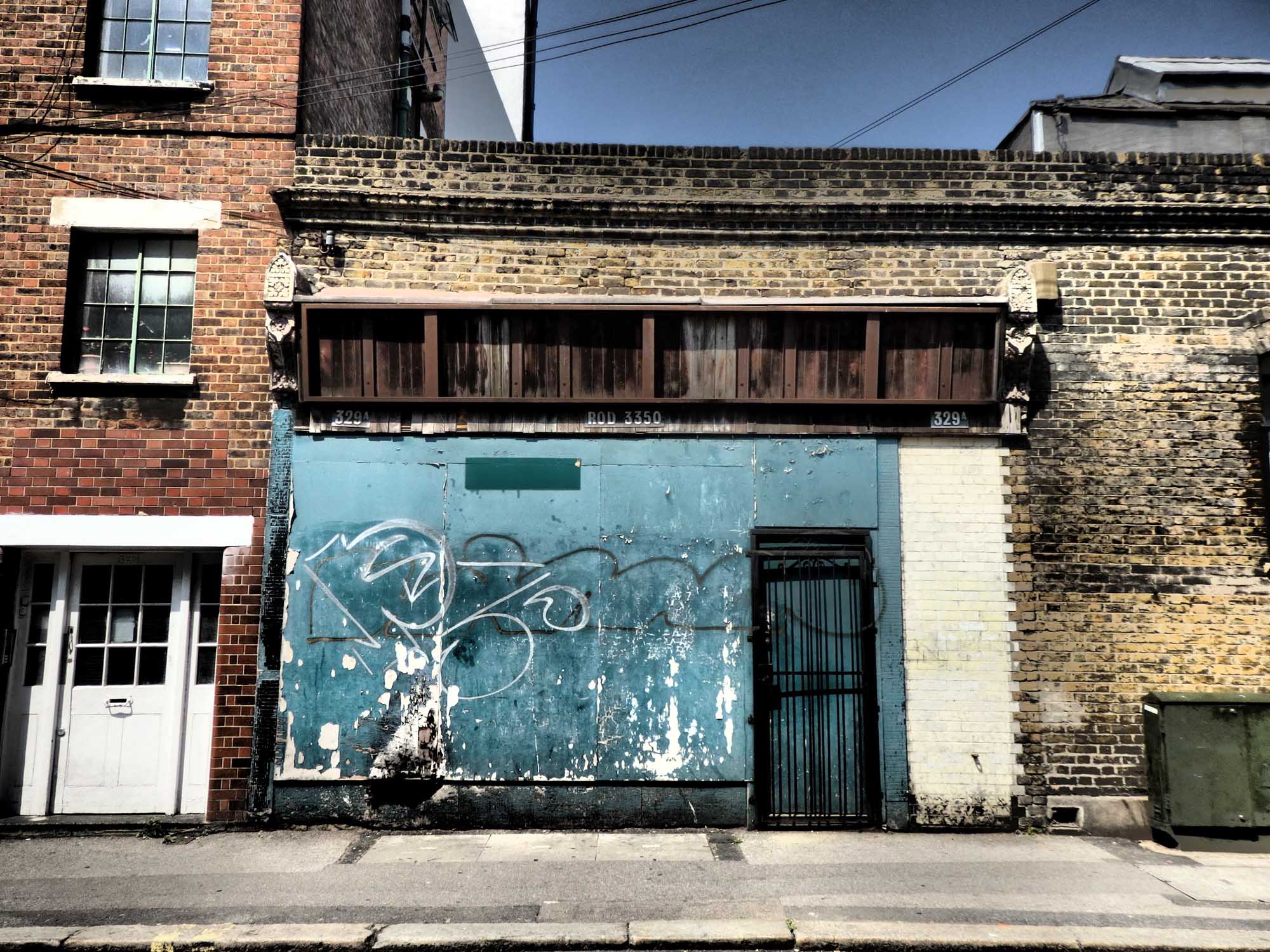 Derelict shopfront boarded up
