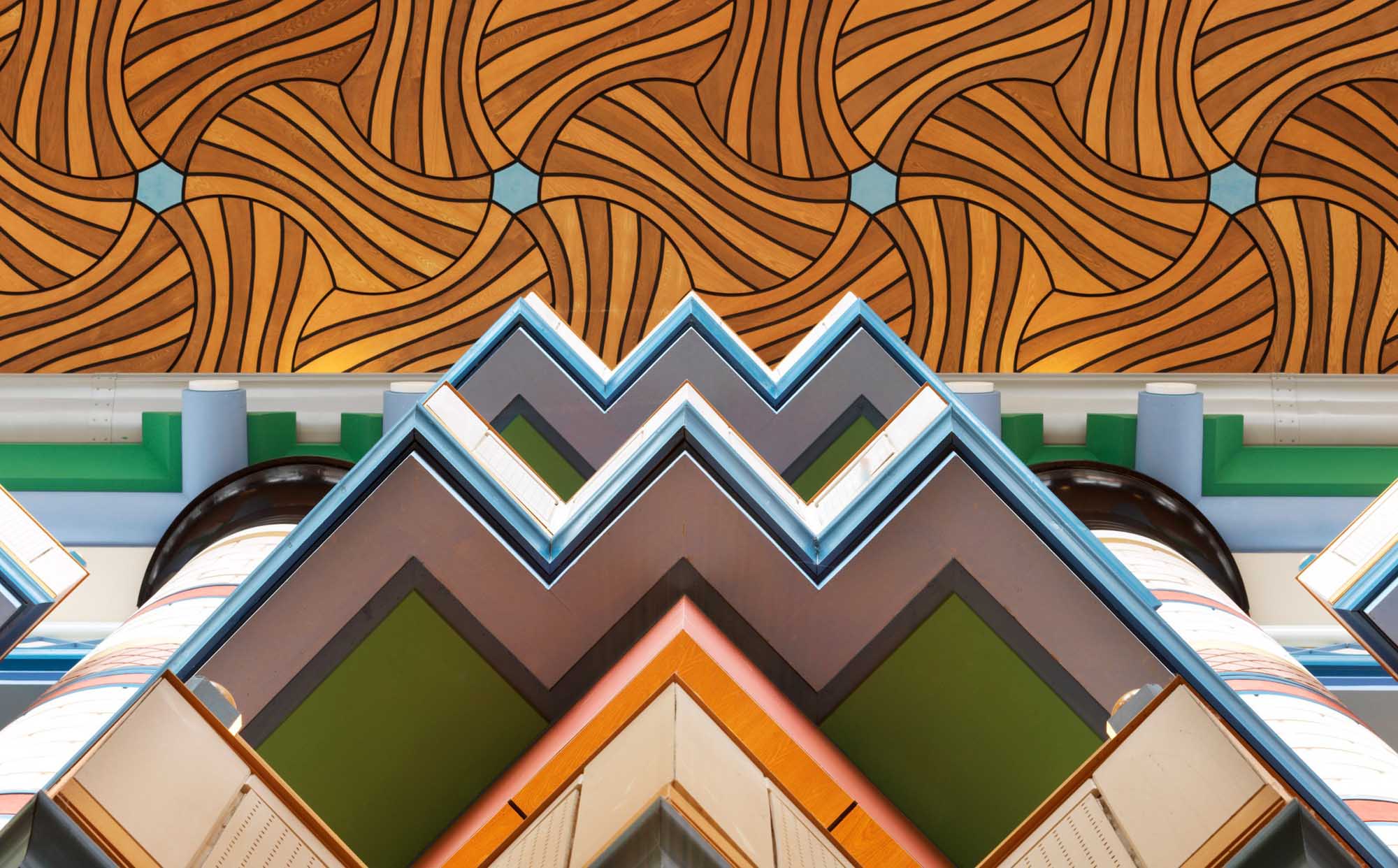 Interior view towards the ceiling of the Judge Institute showing its geometric shapes and patterns.