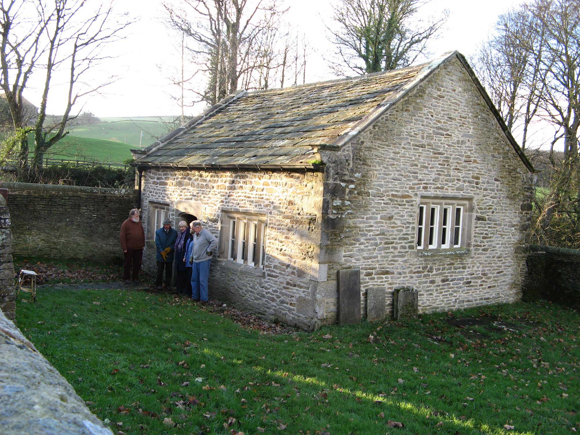 People standing outside Farfield Quaker Meeting House