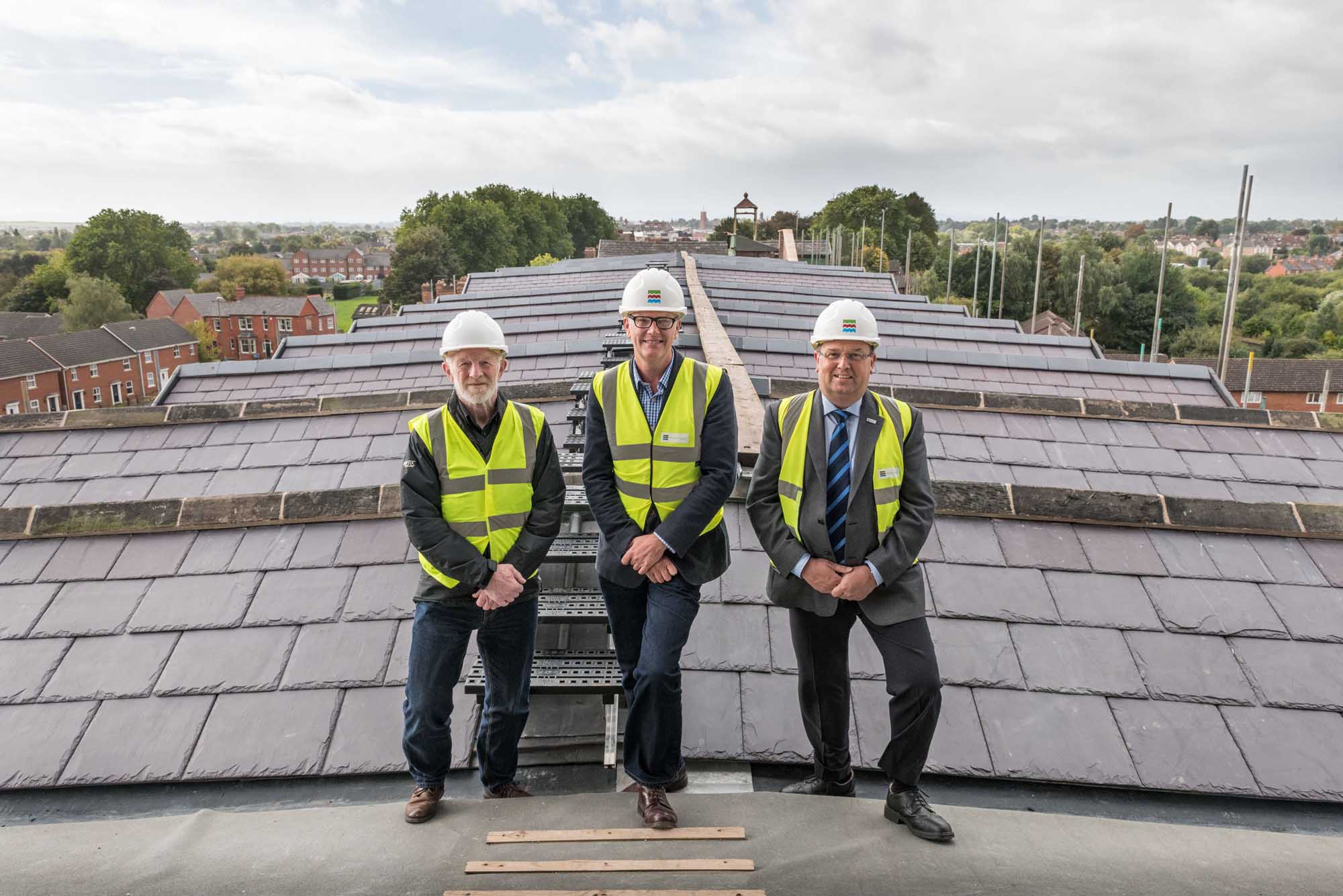 Shrewsbury Flaxmill Maltings new roof on the Main Mill. From left to right, Alan Mosley (The Friends of Flaxmill Maltings Chairman), Alastair Godfrey (Shrewsbury Flaxmill Maltings Project Lead), Nic Laurens (Shropshire Council, Portfolio Holder for Economic Growth).