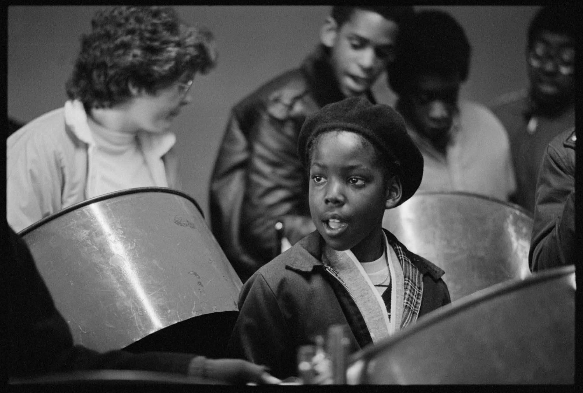 A boy playing a steel drum 