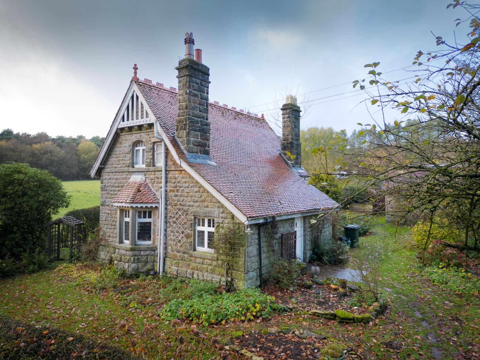 Side and rear elevation of attractive two storey cottage in rural setting