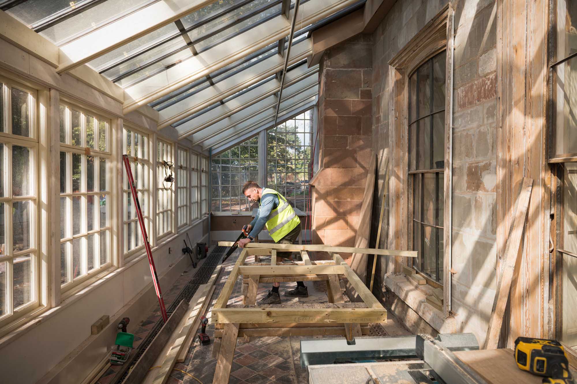 The Charterhouse, London Road, Coventry, West Midlands. Portrait of carpenter/contractor working on site.