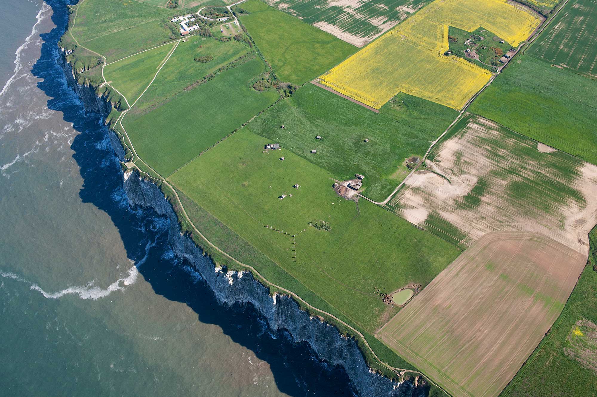 Aerial view of structures and buildings near the cliff edge