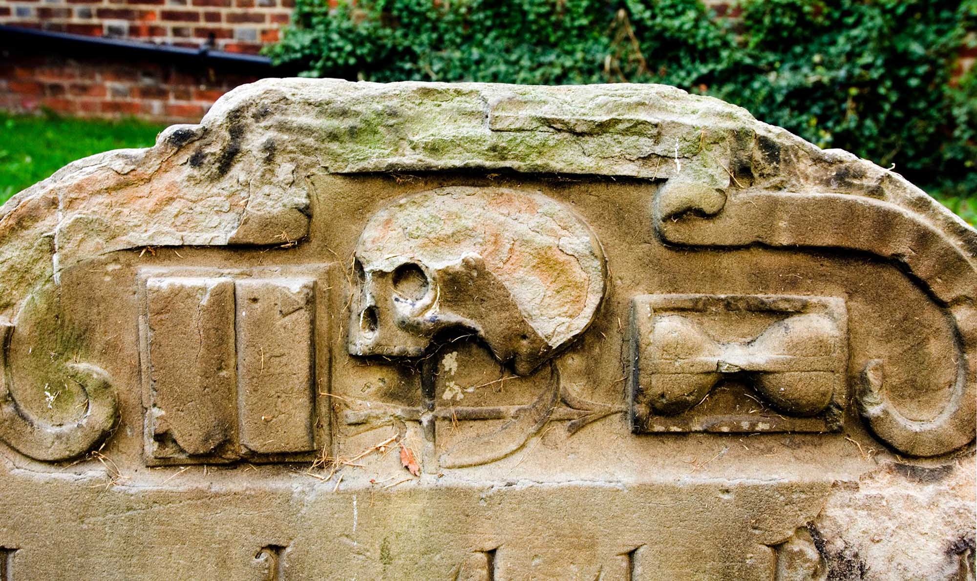 Church of St Peter, Market Street, Sandwich, Kent. Graveyard memorial with skull Church of St Peter, Market Street, Sandwich, Kent. Graveyard memorial with skull