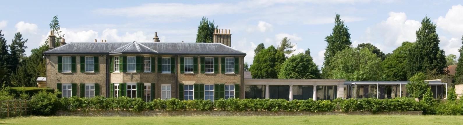 Southerly view of historic office building in direct sunshine.