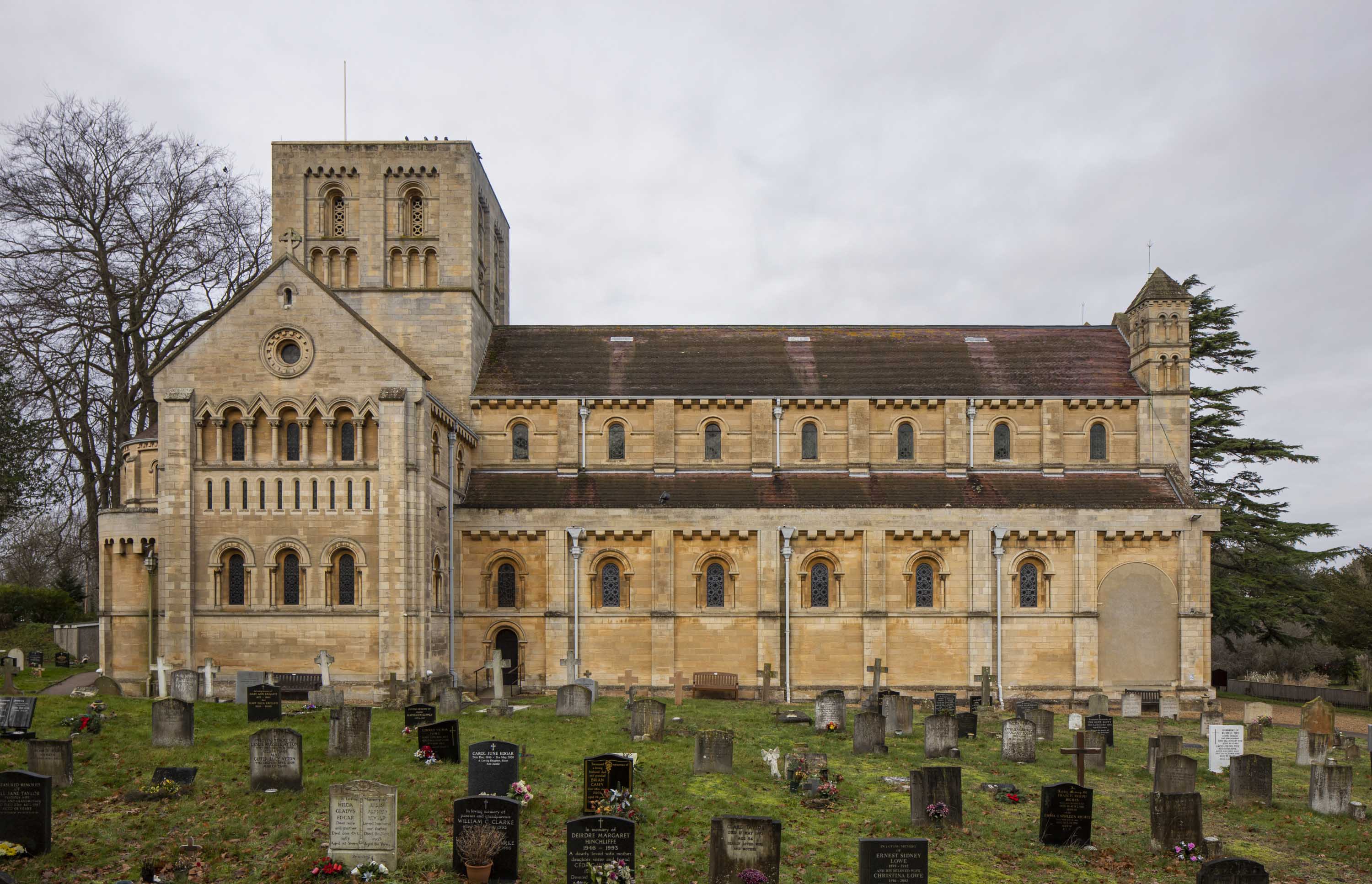 The side view of the Minster Church of St Benet in Beccles shows the grand scale of the church, with its tower, gabled roof and three storey nave.