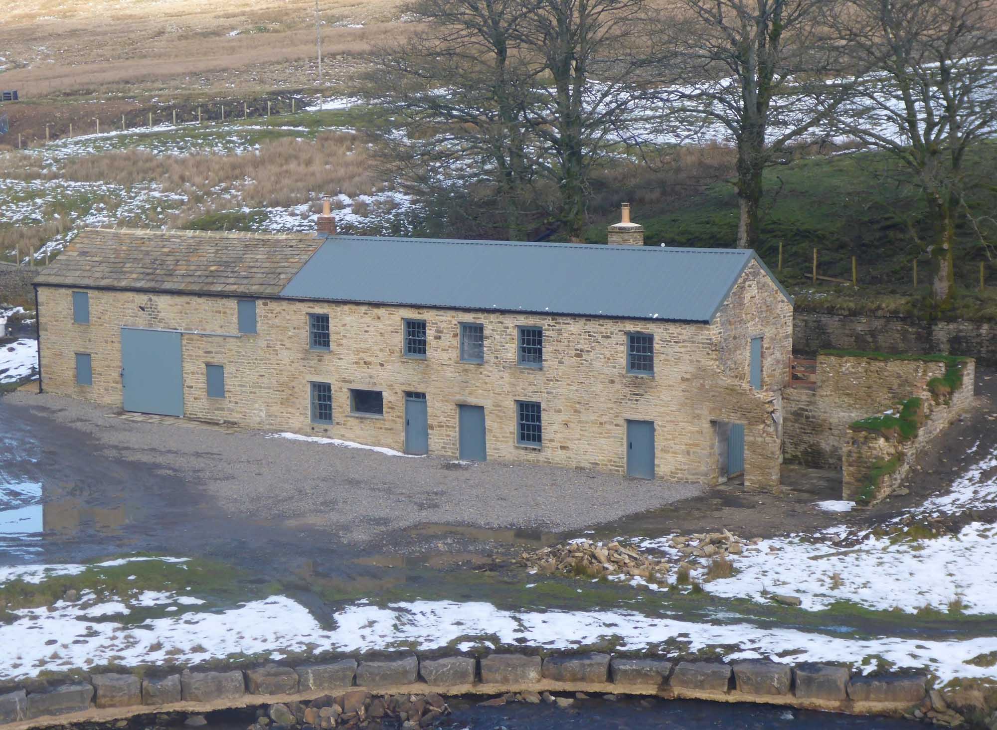 Carrshield camping barn surrounded by melting snow
