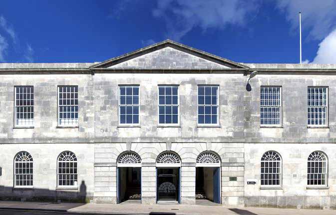 A neoclassical façade in Portland stone on a sunny day
